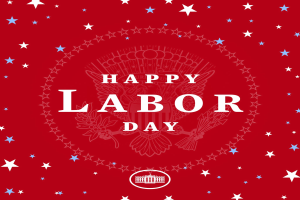 Plakat mit "Happy Labor Day" in fetten weißen Buchstaben auf einem hellroten Hintergrund, umgeben von farbigen Sternen in verschiedenen Größen.