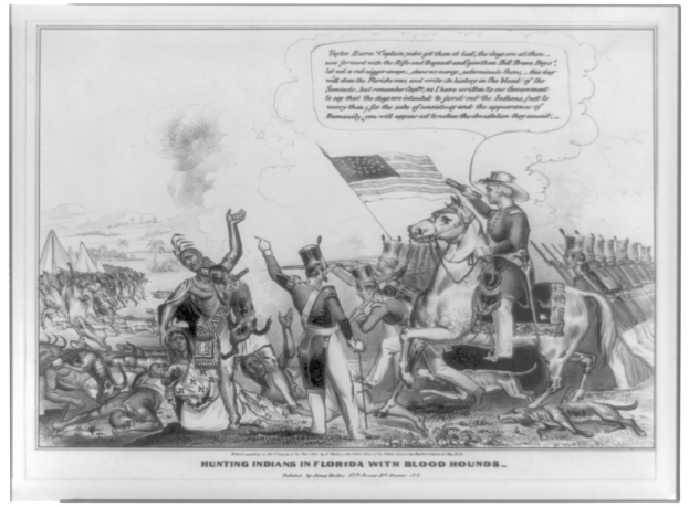 Schwarzes und weißes Foto einer Gruppe von Menschen, einige zu Pferd, mit einer Flagge im Hintergrund und Text, der unten 'Jagen von Indianern in Florida mit Bluthunden' lautet.