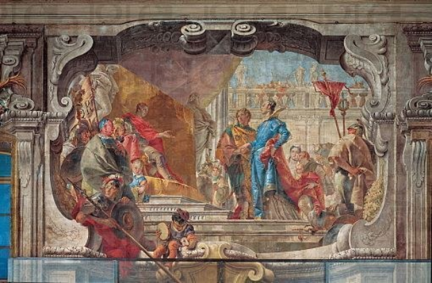 Ein lebendiges und detailliertes Deckengemälde, das eine Gruppe von Menschen, Skulpturen und Gegenständen in realistischem Stil mit verschiedenen Kleidungsstücken und Farben zeigt und Bewegung und Leben vermittelt.